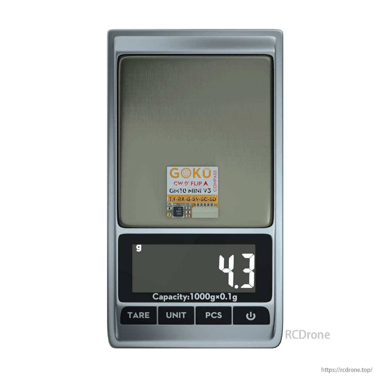 Flywoo GOKU GM10 Mini V3 GPS module on a digital scale showing 4.3 g weight