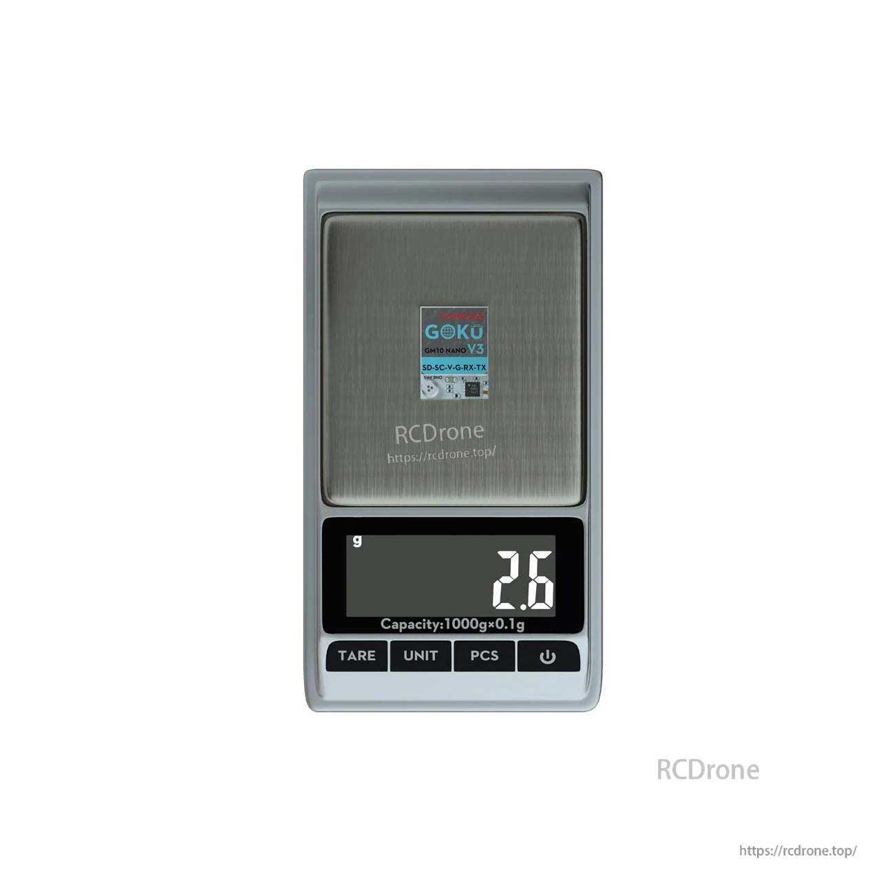 Flywoo GOKU GM10 Nano V3 GPS module on a digital scale, weighing 2.6g