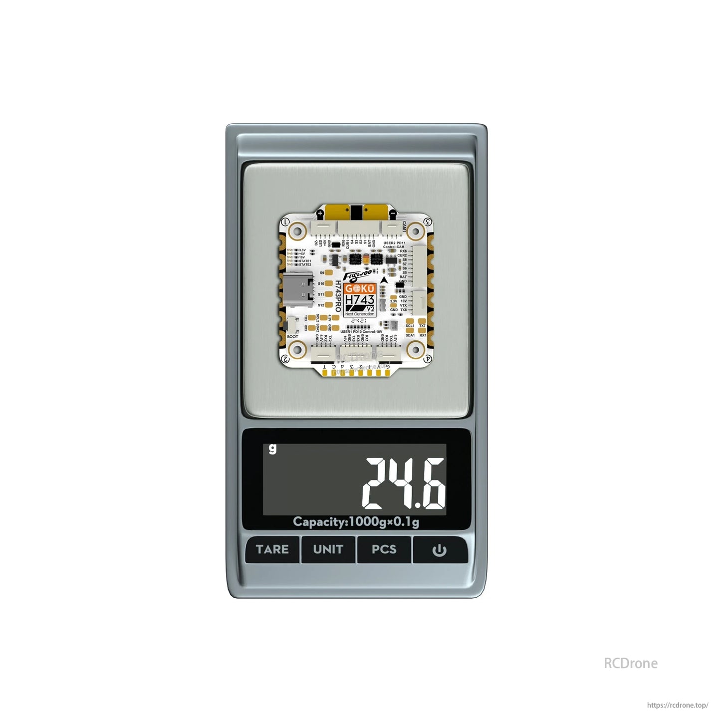 Flywoo GOKU H743 Pro flight controller board on a digital scale showing 24.6 g weight