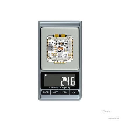 Flywoo GOKU H743 Pro flight controller board on a digital scale showing 24.6 g weight