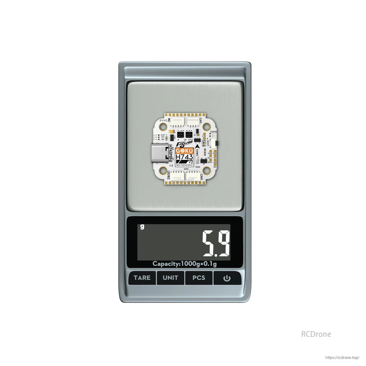 Flywoo GOKU H743 Pro mini flight controller on a digital scale, showing a weight of 5.9g
