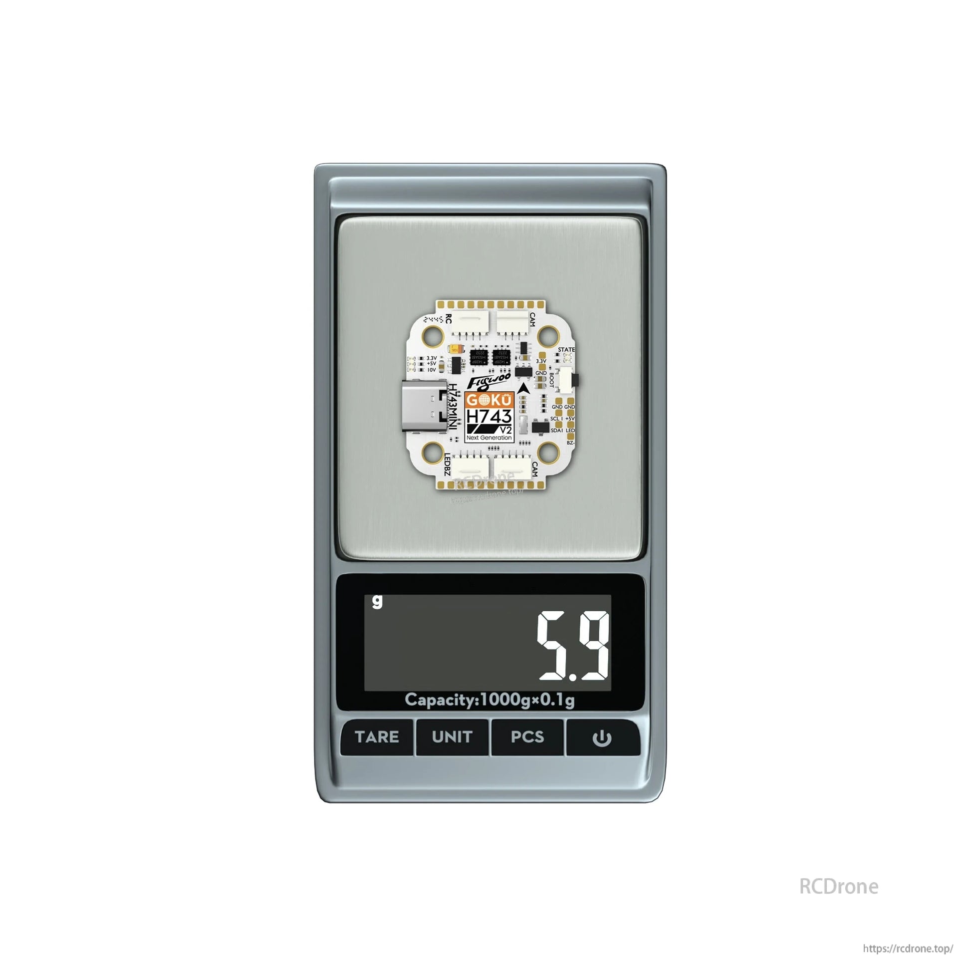 Flywoo GOKU H743 Pro mini flight controller on a digital scale, showing a weight of 5.9g