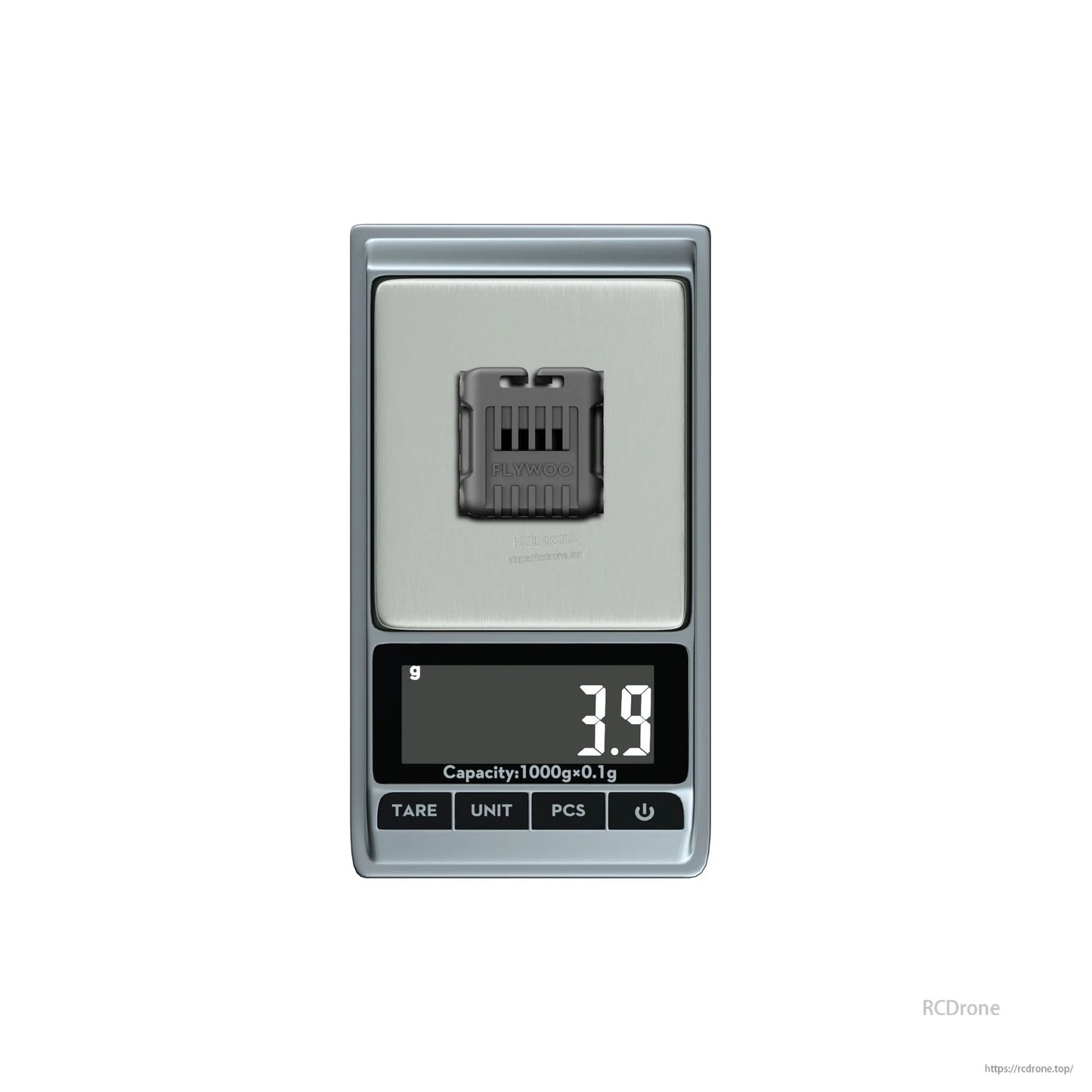Flywoo O4 wide lens component on a digital scale showing 3.9 g weight