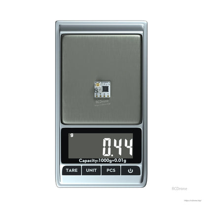 Flywoo TCXO 2.4G ELRS Receiver, Flywoo 2.4GHz ELRS receiver module on a digital scale showing 0.44g weight, compact PCB with solder pads
