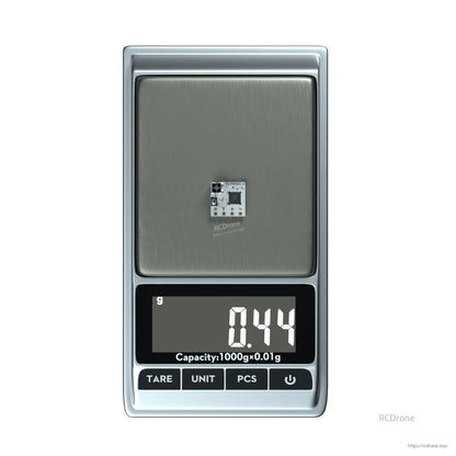 Flywoo TCXO 2.4G ELRS Receiver, Flywoo 2.4GHz ELRS receiver micro PCB on a digital scale reading 0.44 g