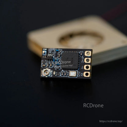 Foxeer ELRS 915/868MHz Receiver, Foxeer ELRS 915/868MHz micro receiver module with u.FL antenna connector, solder pads, and 32.000 MHz crystal