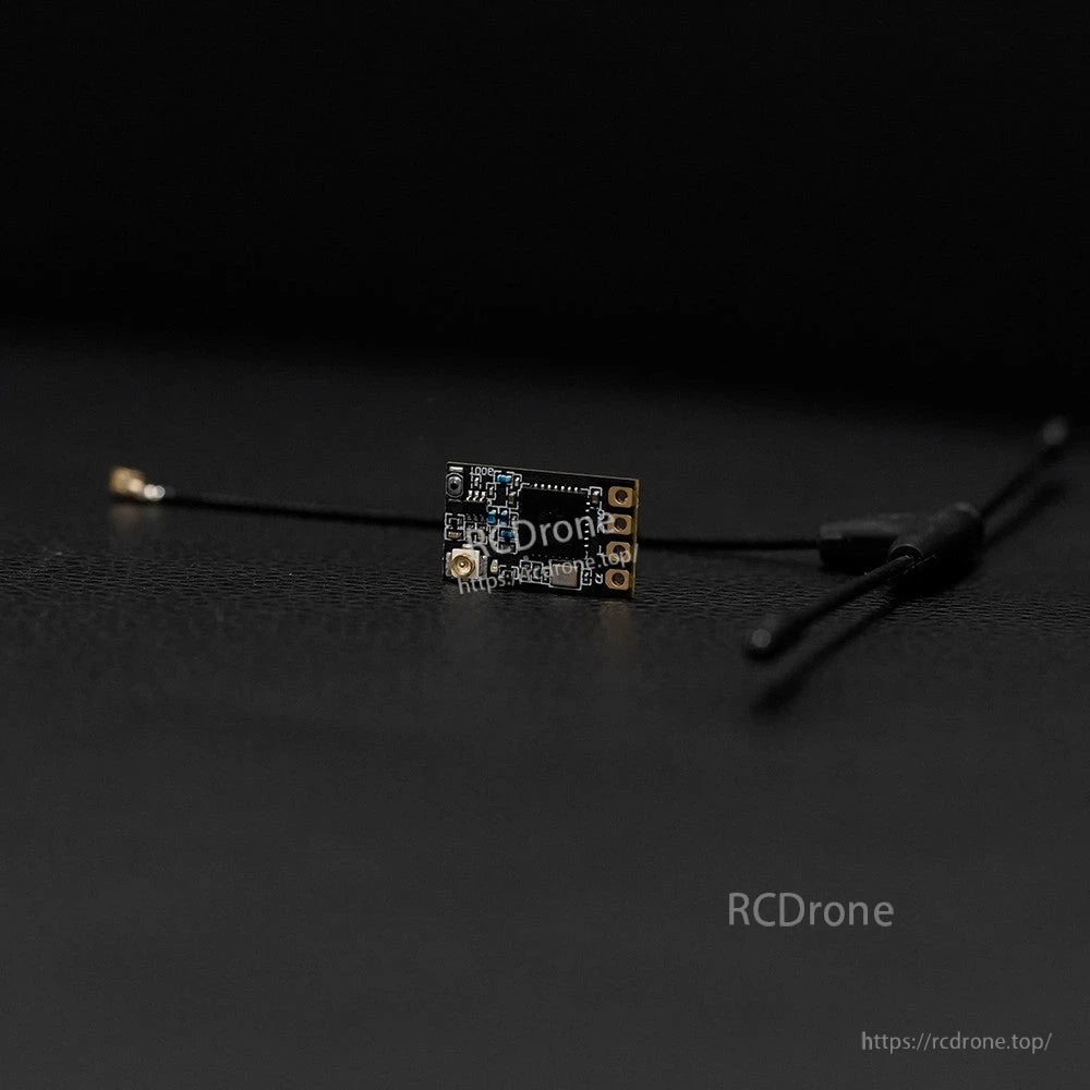 Foxeer ELRS 915/868MHz receiver module with compact PCB, solder pads, and coax antenna lead