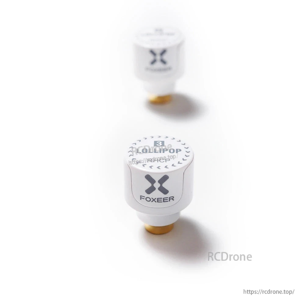 Two Foxeer Lollipop 3 stubby omni FPV antennas in white with SMA connectors, compact mushroom-style design