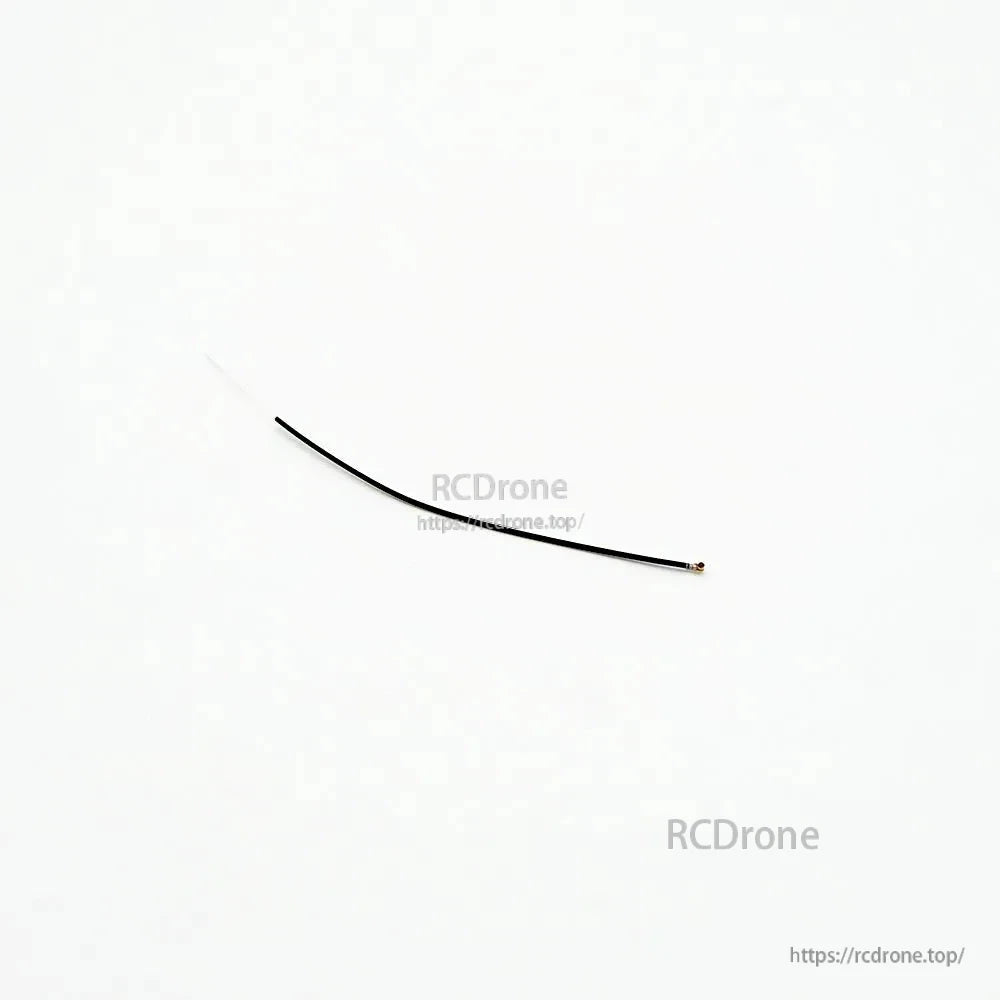 Micro coax spare antenna wire with small connector and exposed antenna end, top-down view