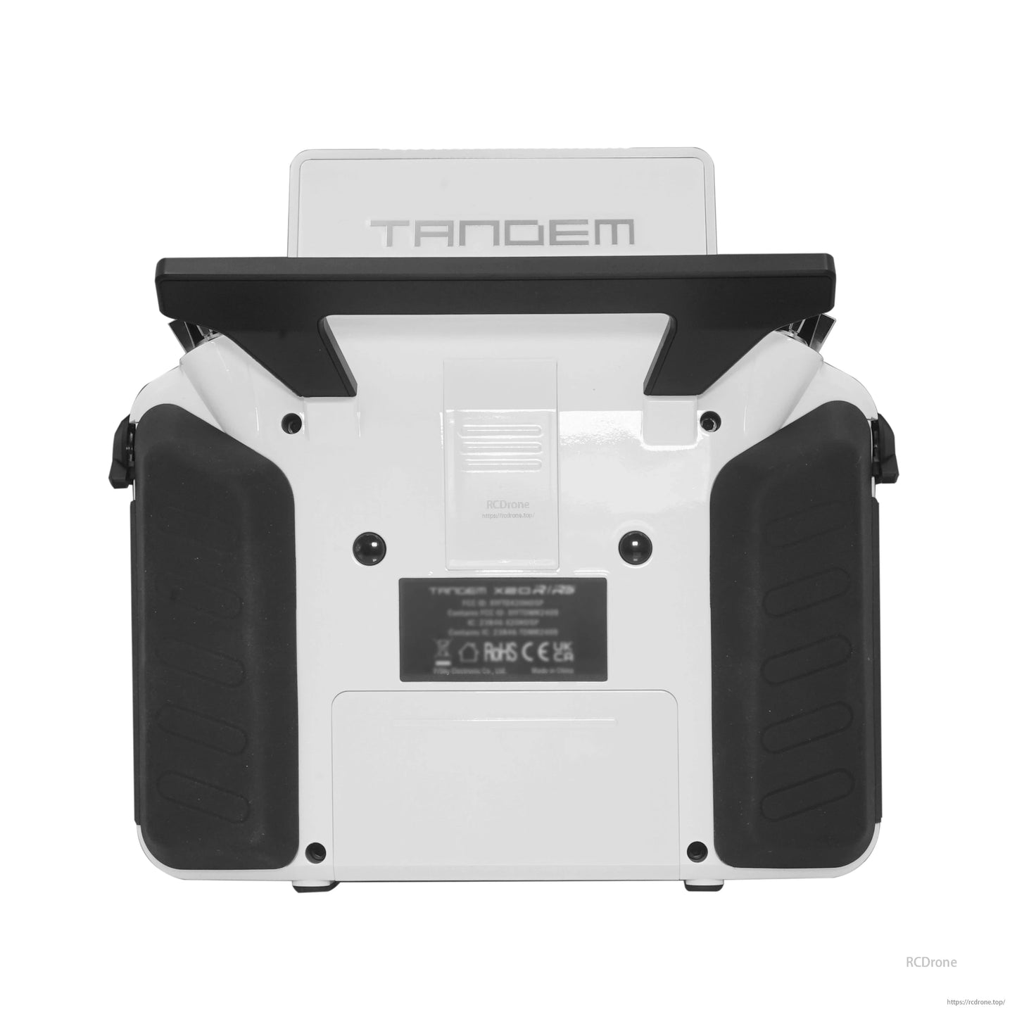 White TANDEM X20RS transmitter rear view showing grips, rear label area, and back panel
