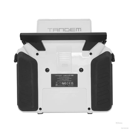 White TANDEM X20RS transmitter rear view showing grips, rear label area, and back panel