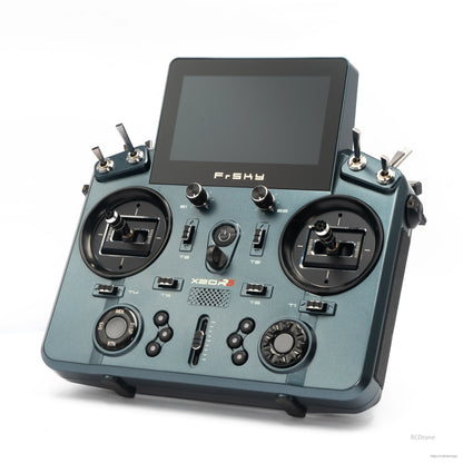 Dark gray TANDEM X20RS transmitter angled view highlighting gimbals, switches, and screen