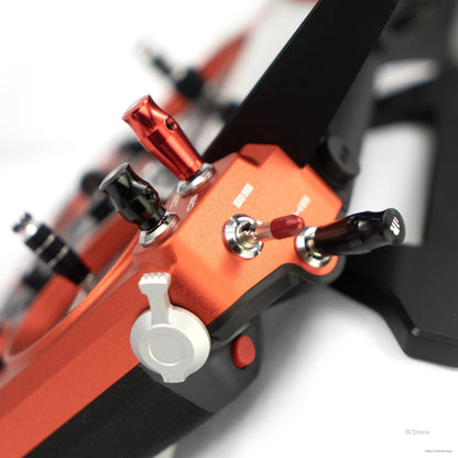 Close-up of FrSky Tandem X20 PRO AeroWing Edition transmitter top panel with metal switches and knobs