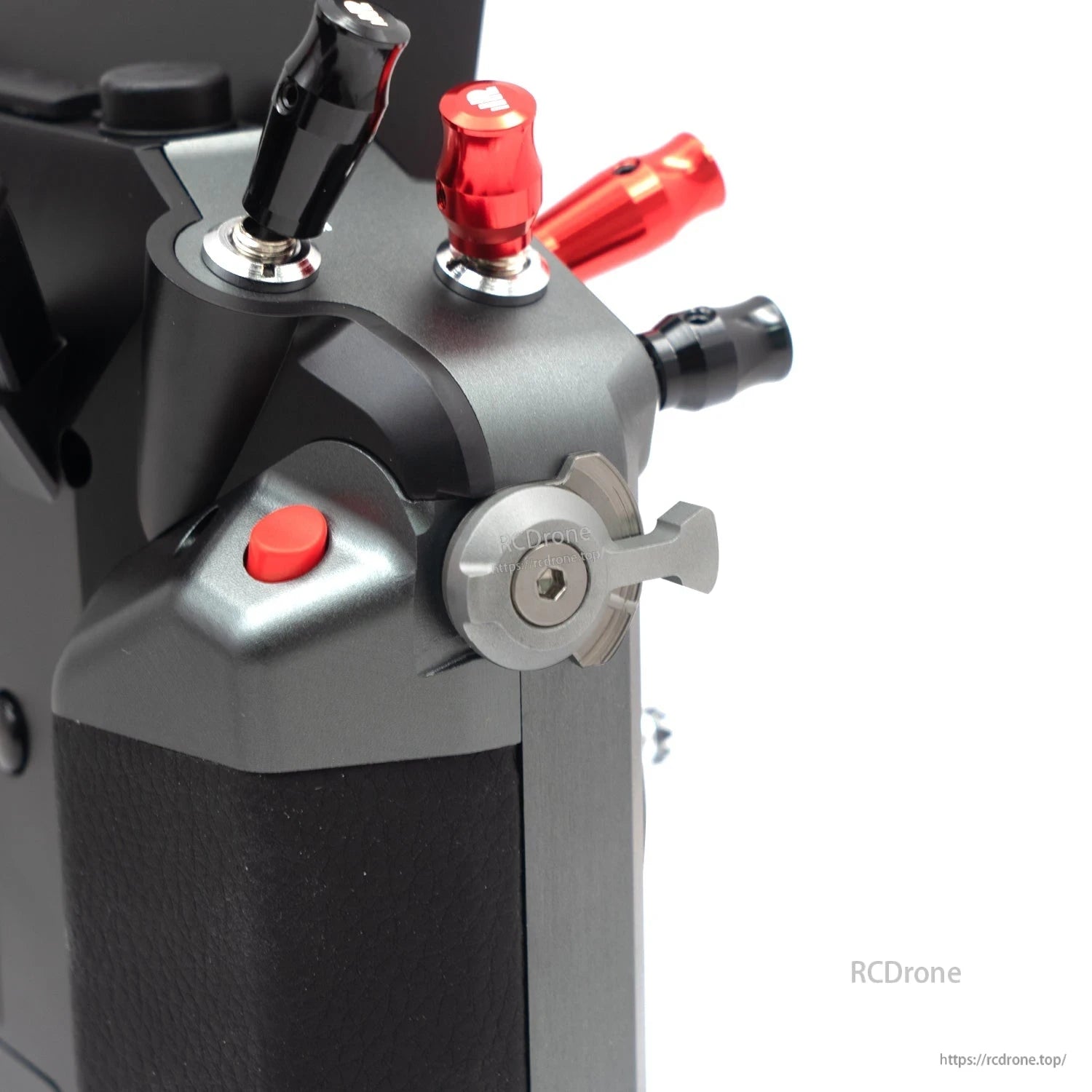 Angled close-up of metal self-locking switch and top corner switches on Tandem X20 PRO transmitter