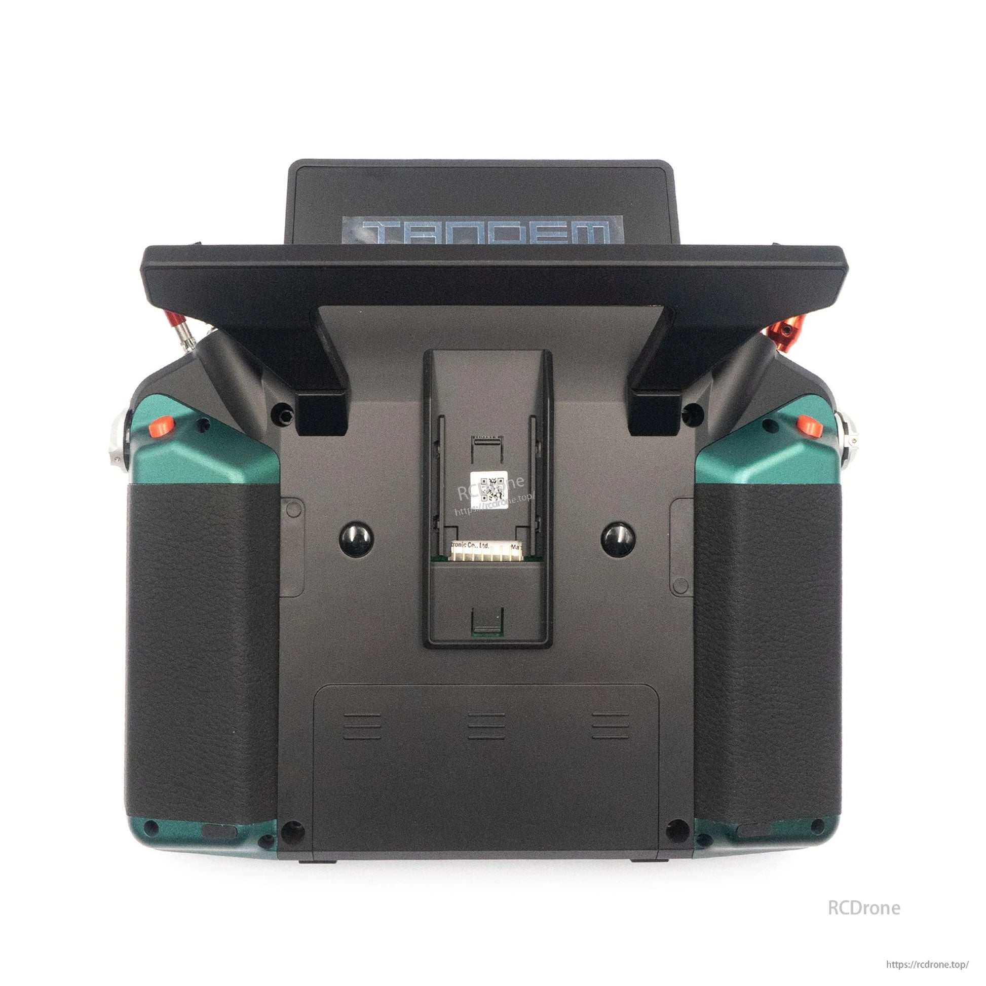 Rear view of green Tandem X20 PRO transmitter with battery compartment area and side grips