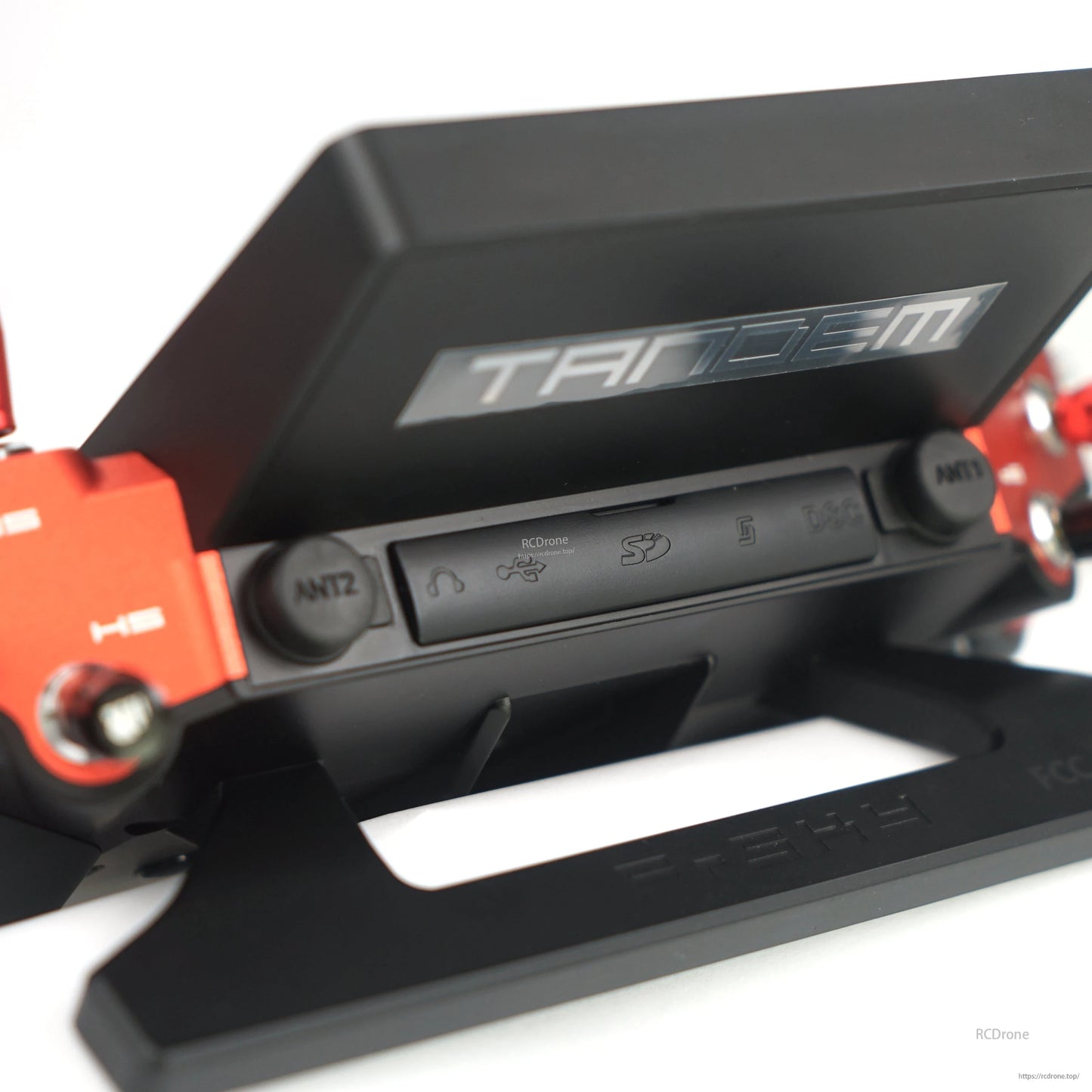 Close-up under screen showing ANT2 connector and icon-labeled port cover on Tandem X20 PRO