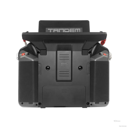 Rear view of gray Tandem X20 PRO transmitter showing back cover, grips, and carry handle mount