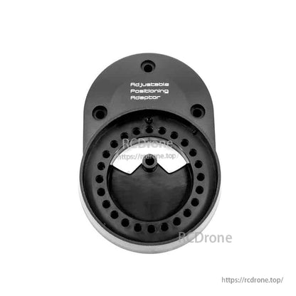Front view of adjustable positioning wheel adapter plate showing perforated ring and mounting screw holes