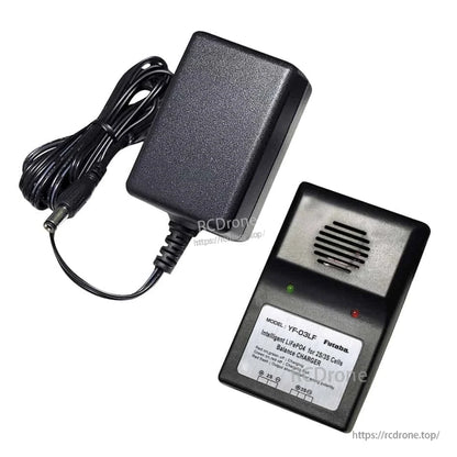 LiFe battery charger unit with speaker grille and red/green status LEDs, shown with plugged-in power adapter