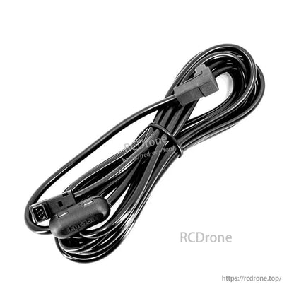 Coiled black trainer cable with square micro plug and Futaba-molded connector end, secured with a cable tie