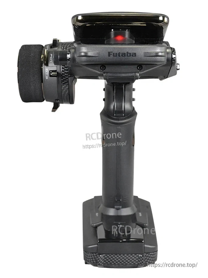 Futaba T10PXR 10-channel surface transmitter with pistol-grip handle, foam steering wheel, and top display