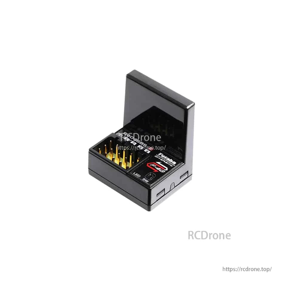 R404SBS receiver in open case showing channel pins and side button/indicator details