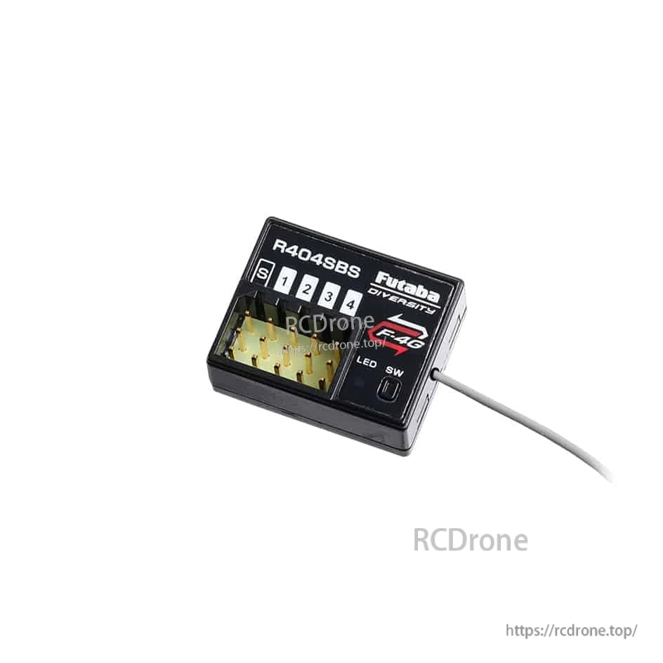Futaba R404SBS F-4G telemetry receiver close-up showing channel ports 1–4 and antenna lead