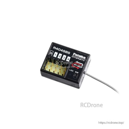 Futaba R404SBS F-4G telemetry receiver close-up showing channel ports 1–4 and antenna lead