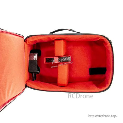 Red padded interior of transmitter bag with center divider pad and side strap attachment