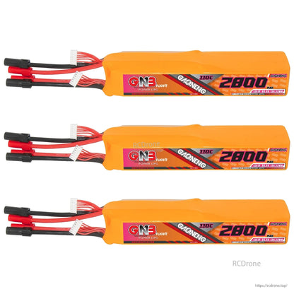 Three orange GNB 12S 2800mAh LiPo batteries lined up, label side visible