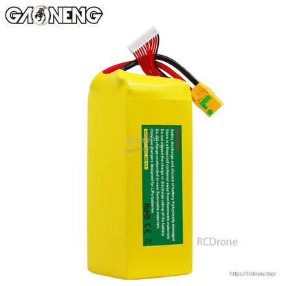 Rear view showing safety warning label on GAONENG battery pack, with balance lead and XT90S-F connector