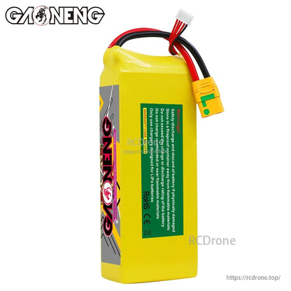 Side view showing green safety warning label on GAONENG battery pack and attached leads