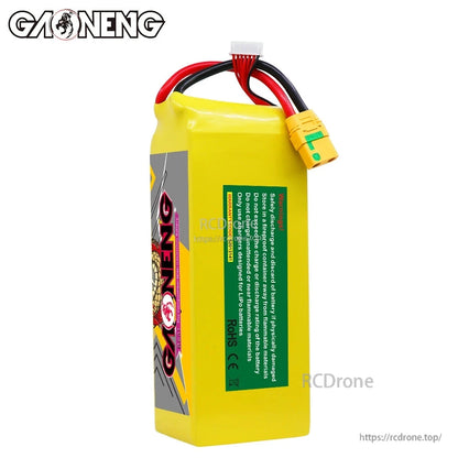 Rear view of GAONENG battery pack showing green safety/notice label, XT90S connector and balance plug