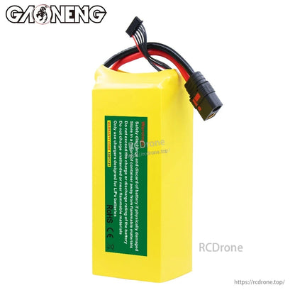 Rear side of battery showing green safety label and top leads with QS8-style discharge connector