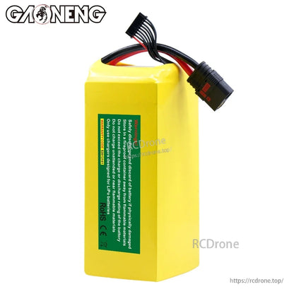Rear view showing green safety notice label and CE/RoHS marks on yellow battery pack