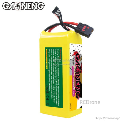 Rear/side view showing green safety information label and QS8 discharge connector on lead