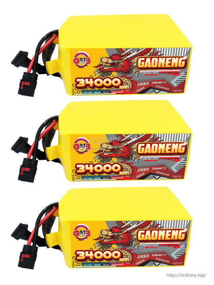 Three yellow GAONENG 34000mAh battery packs laid flat, label side visible with connector leads