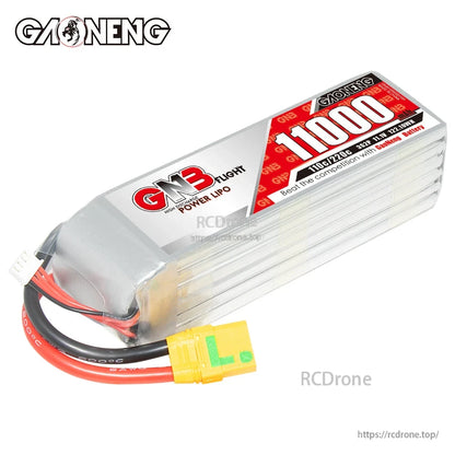 Angled top view of GNB 11000mAh LiPo battery showing label and XT90S-style connector on leads