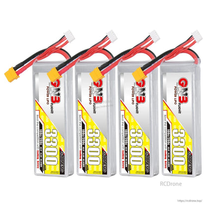 Four GNB 3300mAh LiPo batteries lined up, label side visible with XT60 connectors