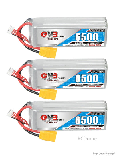 Three GNB 6500mAh LiPo batteries stacked horizontally, showing labels and XT90 connectors