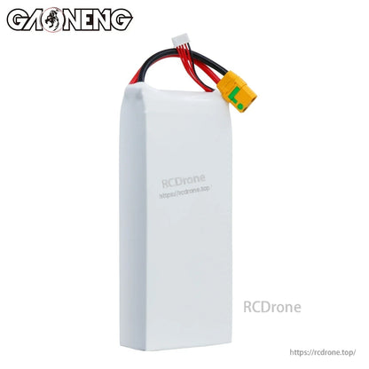 Side view of white battery casing with wires and yellow XT90S connector