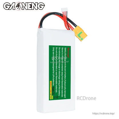 Back side of GNB battery showing green safety/handling warning label and XT90S lead