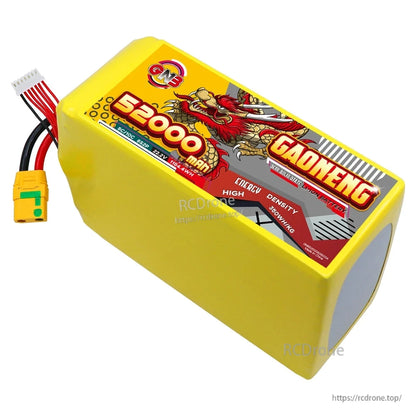 Angled top view of yellow 52000mAh GAONENG battery pack showing label panel and rounded end cap