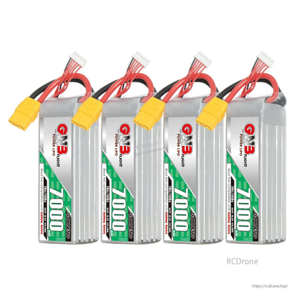 Four GNB 7000mAh LiPo batteries lined up, showing label sides and yellow power connectors