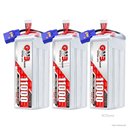 Three GNB 11000 LiPo batteries displayed upright with QS8 connectors