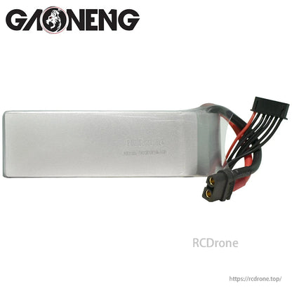 Plain side view of silver LiPo pack showing wire exit, balance lead, and XT60 connector end