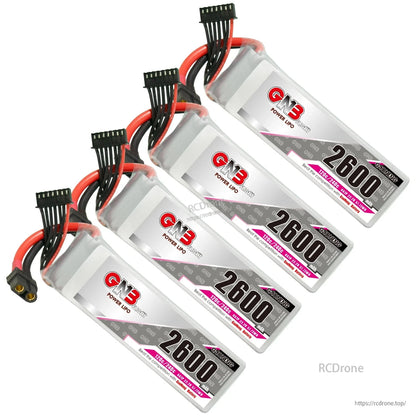 Four GAONENG GNB 2600mAh LiPo batteries arranged diagonally showing labels and connector leads
