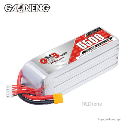 Angled top view of GNB 6500mAh LiPo pack showing end cap, wiring exit, XT60 plug, and balance lead