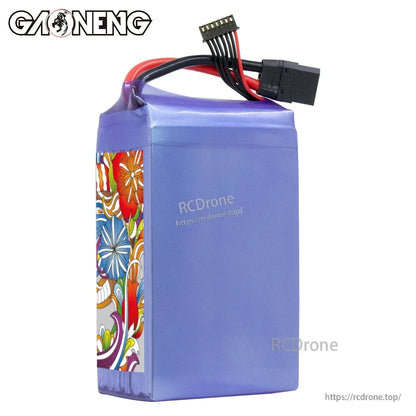 Plain side view of purple shrink-wrapped GNB LiPo battery showing XT90 plug and balance connector