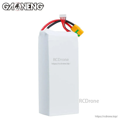 Side/back view of white battery casing showing wire exit and connectors